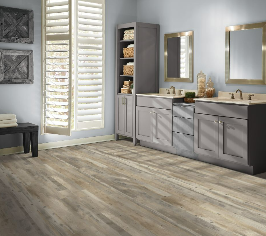 Light grey and brown Mohawk LVP floors provide style and durability for a modern bathroom.
